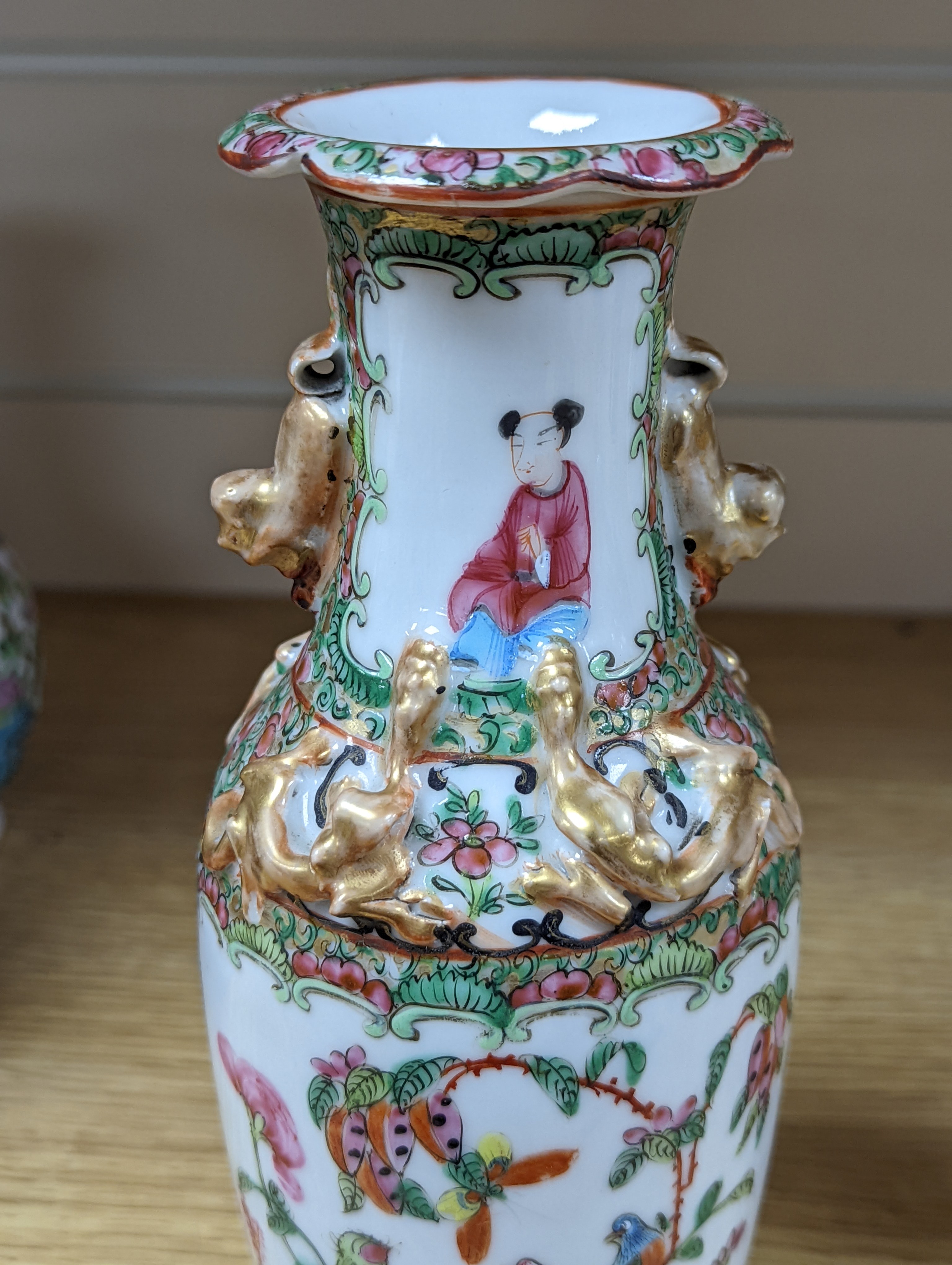 Four 19th century Chinese famille rose vases, 21cm